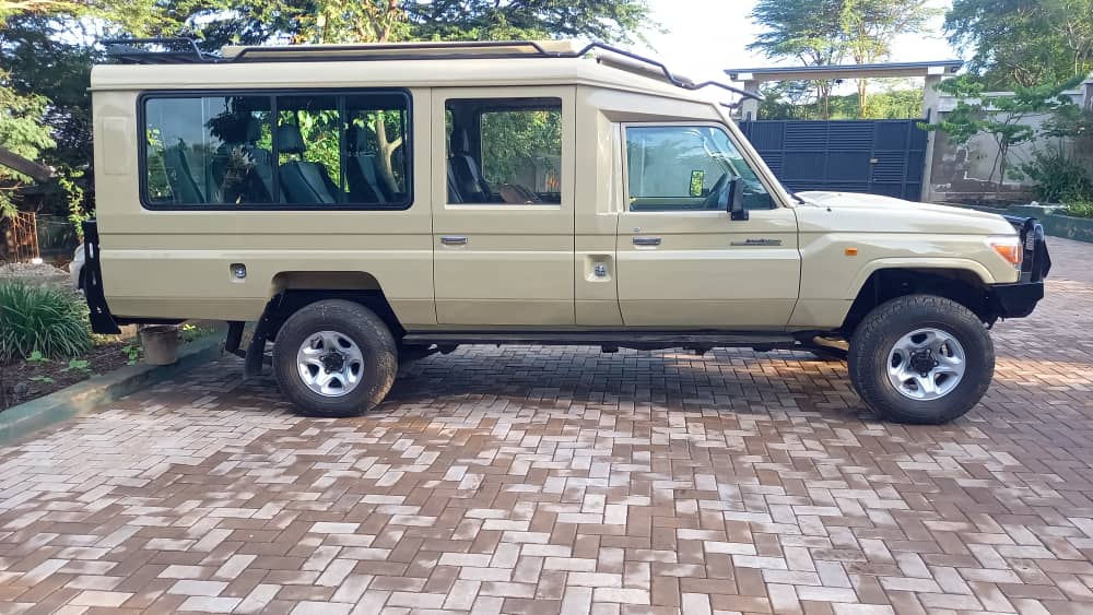 A green safari Land Cruiser ready for a northern Tanzania road trip
